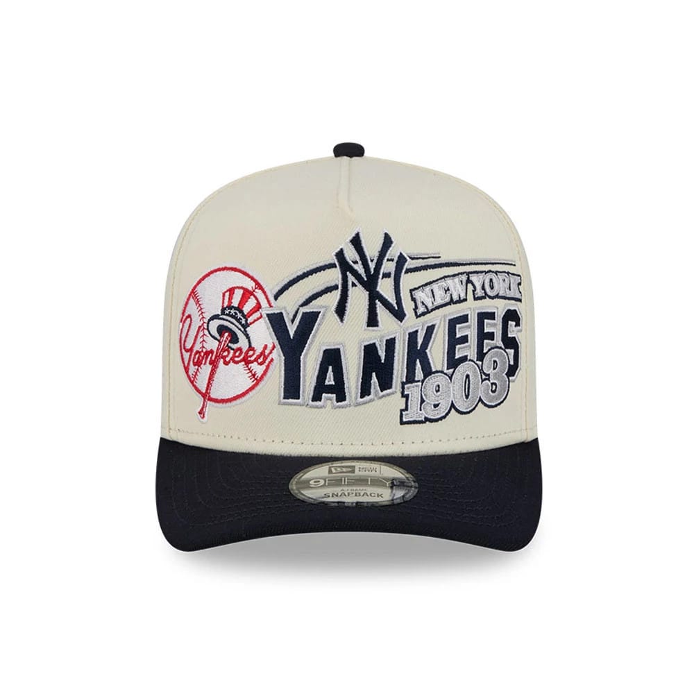 New York Yankees MLB Classic Cream New Era 9FIFTY A-Frame Snapback Adjustable Cap, front view with raised Yankees logos and 1903 lettering in navy and red embroidery on cream front panel and a black flat visor featuring a 9FIFTY size sticker.