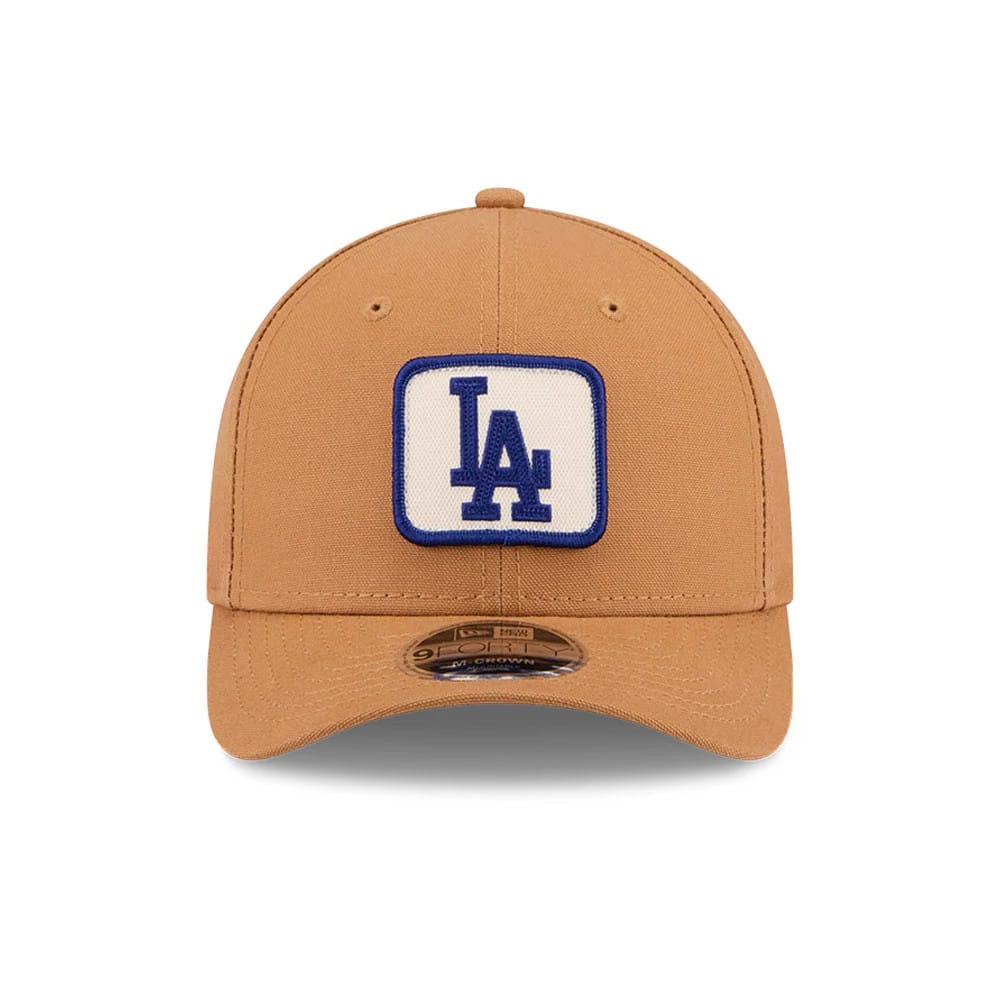 LA Dodgers MLB Team Choice Beige New Era 9FORTY M-Crown Adjustable Cap, front view showing a blue LA logo embroidered on a white square patch on the centre front panel with a brown curved visor and a 9FORTY size sticker.