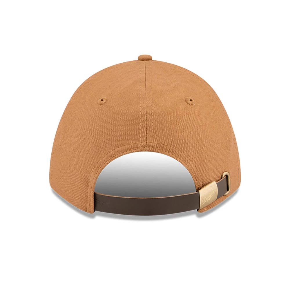 LA Dodgers MLB Team Choice Beige New Era 9FORTY M-Crown Adjustable Cap, rear view showing a brass buckle on the dark brown adjustable strap, with vented eyelets on the beige fabric and a curved crown.