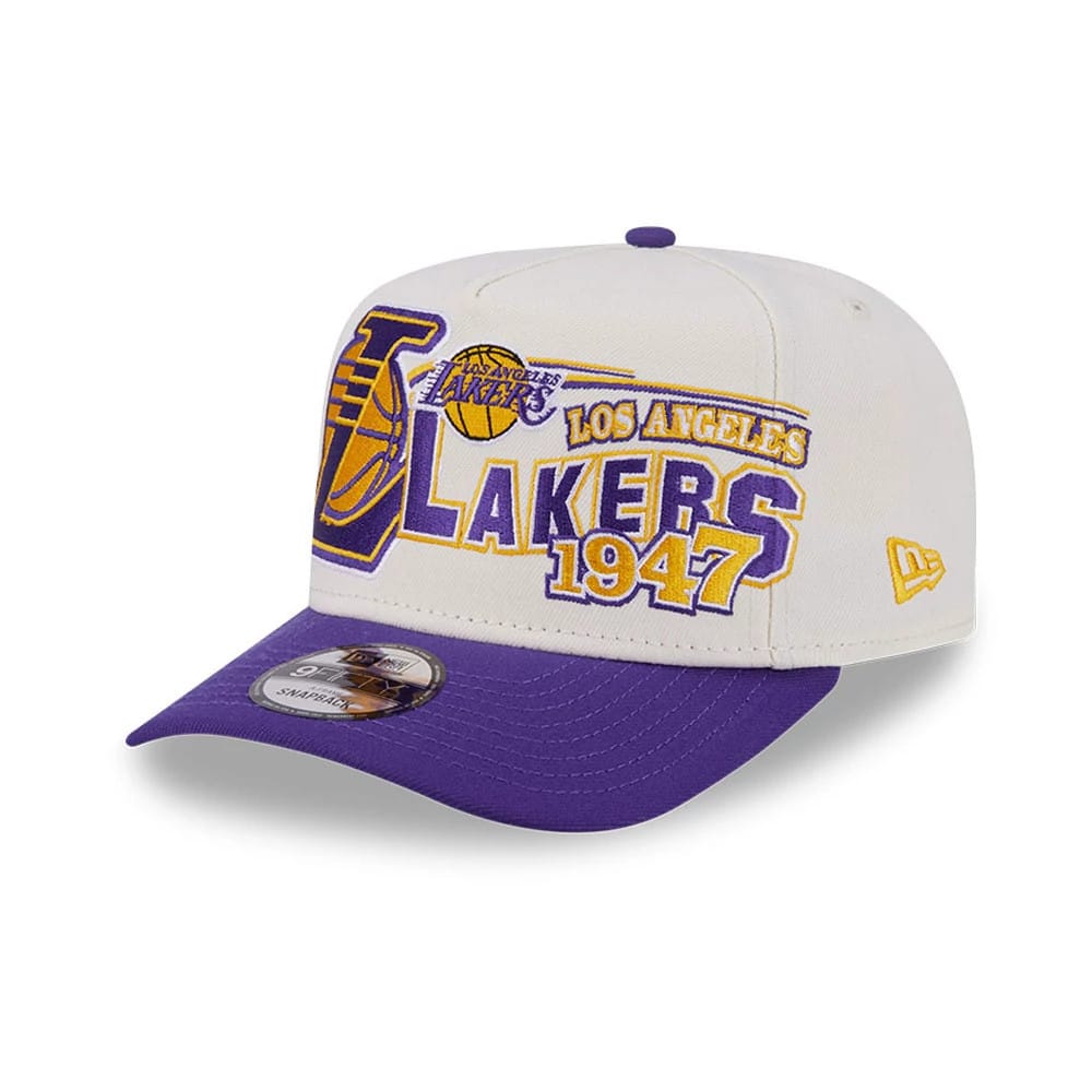 LA Lakers NBA Classic White New Era 9FIFTY A-Frame Snapback Adjustable Cap, three-quarter view featuring a raised embroidered LA Lakers logo in purple and gold on the front panels, with a contrasting purple visor.