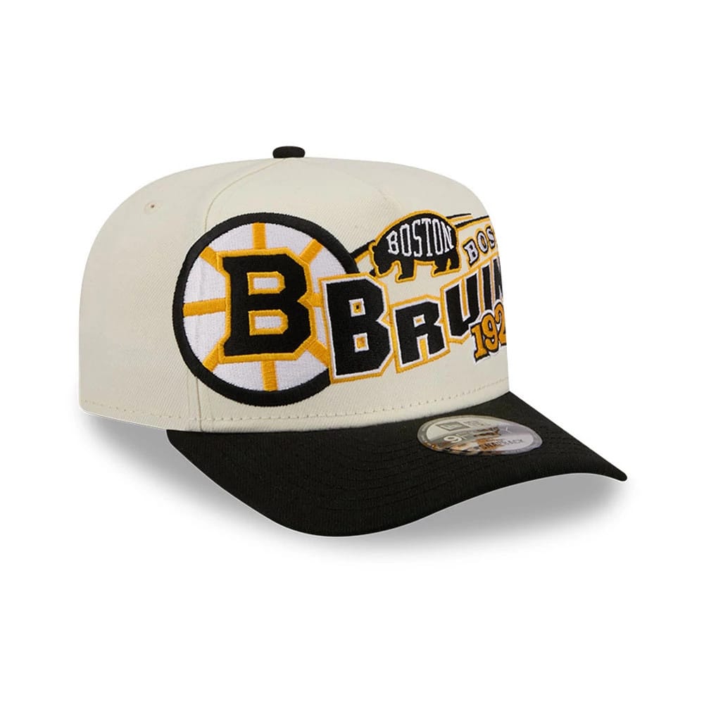 Boston Bruins NHL Classic White New Era 9FIFTY A-Frame Snapback Adjustable Cap, three-quarter view showing the large embroidered Bruins logo on the front panels, a black flat visor, and a 9FIFTY size sticker on the top.