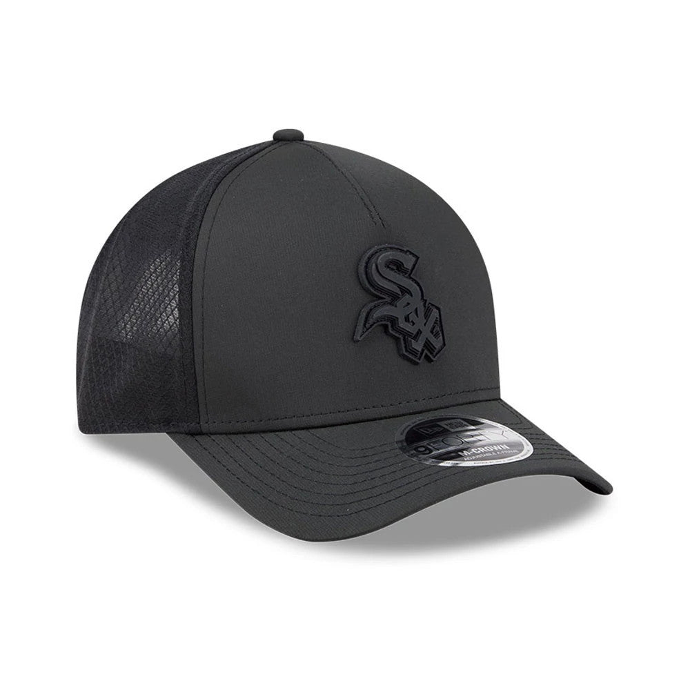 Chicago White Sox MLB Badged Black New Era 9FORTY M-Crown A-Frame Trucker Cap, three-quarter view showing the black embroidered Sox logo on the front panel, curved black visor with 9FORTY size sticker, and black mesh side panels.