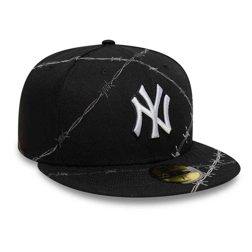New York Yankees MLB Wire Black New Era 59FIFTY Fitted Cap, three-quarter view with a raised white NY logo embroidered on the front panel, barbed wire pattern across the structured black crown and visor, and a gold 59FIFTY size sticker.