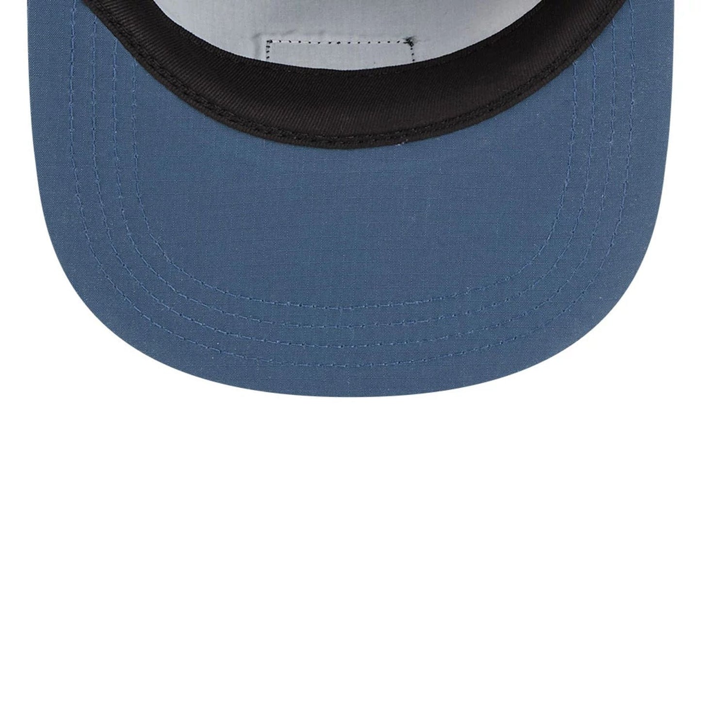 New Era The Goonies Astoria Warner Brothers Open Blue Camper Cap, inside view showing the black sweatband and grey crown lining, with the blue stitched visor extending below.