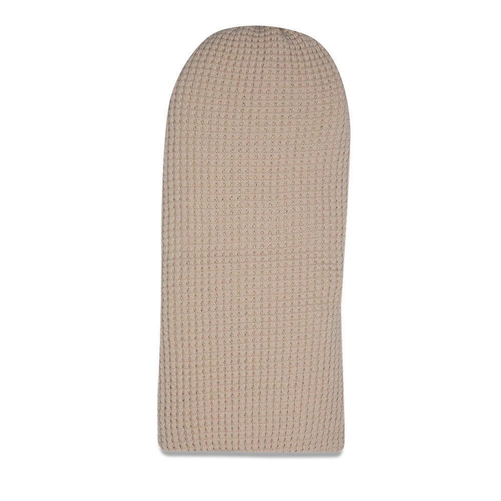New Era Waffle Knit Light Beige Balaclava, front view showing the textured waffle knit pattern across the entire surface with a curved top, offering a seamless and cosy design in a light beige hue.