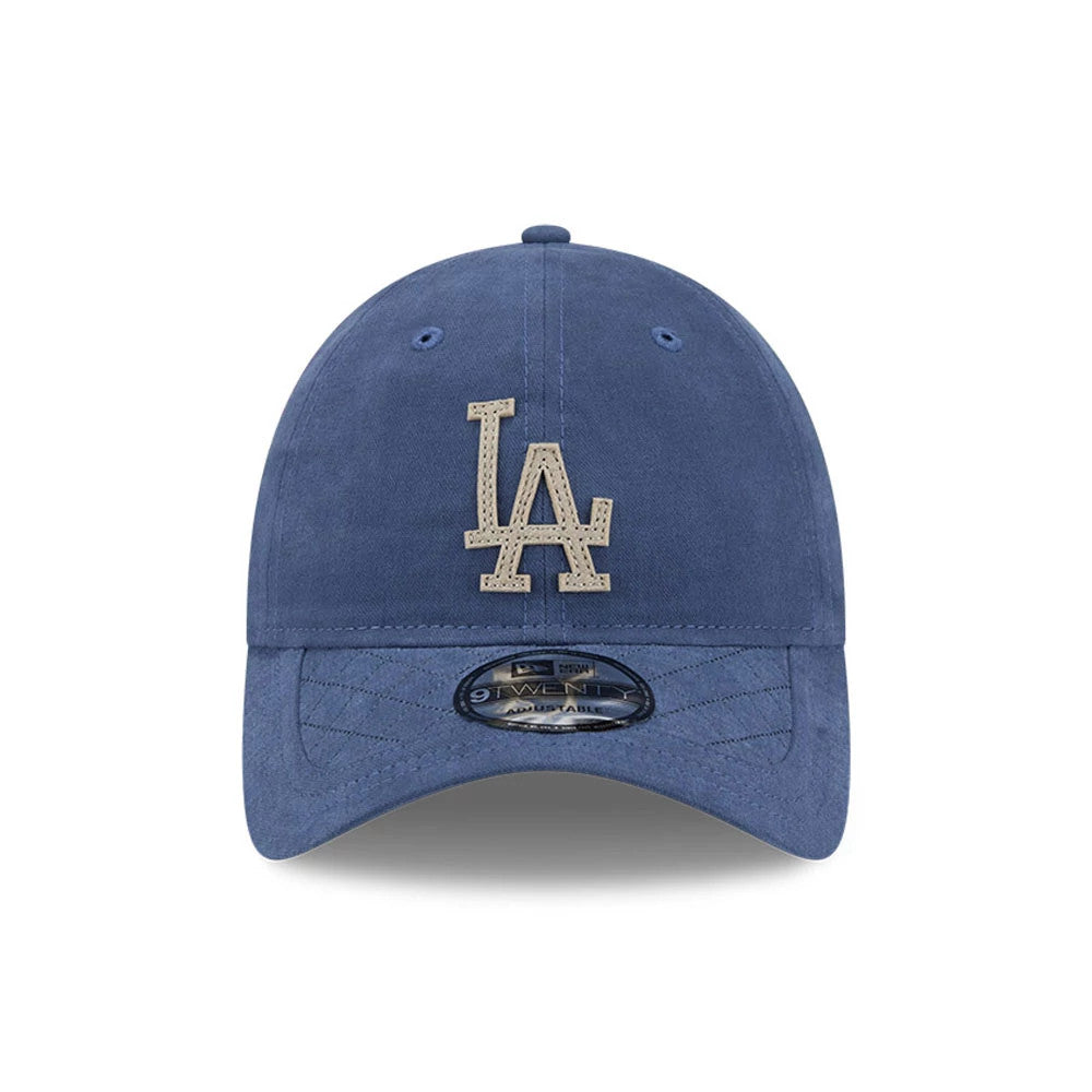 LA Dodgers MLB Quilted Dark Blue New Era 9TWENTY Adjustable Cap, front view showing the raised embroidered light brown LA logo on the dark blue crown, with a curved visor and a 9TWENTY size sticker on the visor.