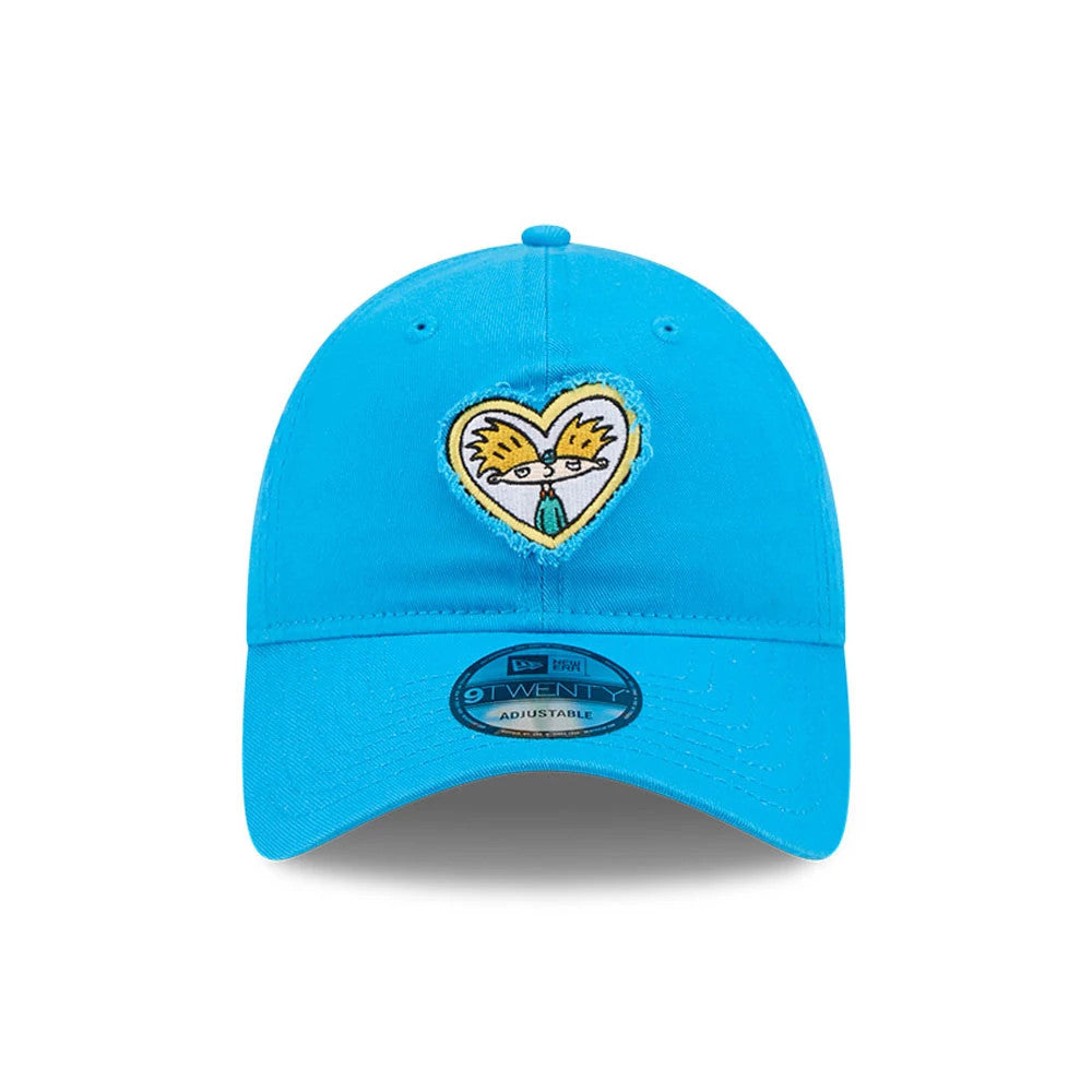 Hey Arnold Heart Blue New Era 9TWENTY Adjustable Cap, front view showing the embroidered heart-shaped graphic of Hey Arnold's face on the structured blue crown, with a curved visor and a 9TWENTY size sticker.