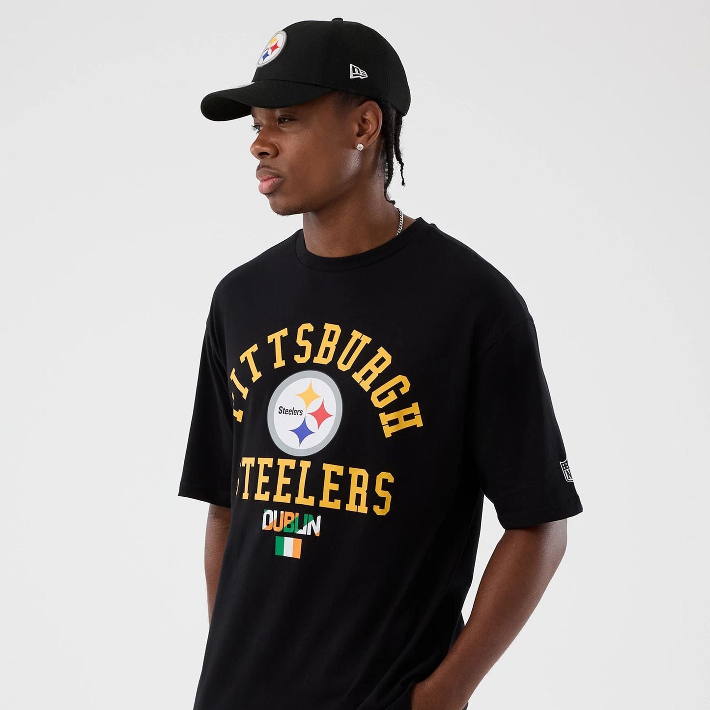 The Male model is wearing Pittsburgh Steelers NFL International Series Games Black Oversized T-Shirt 7