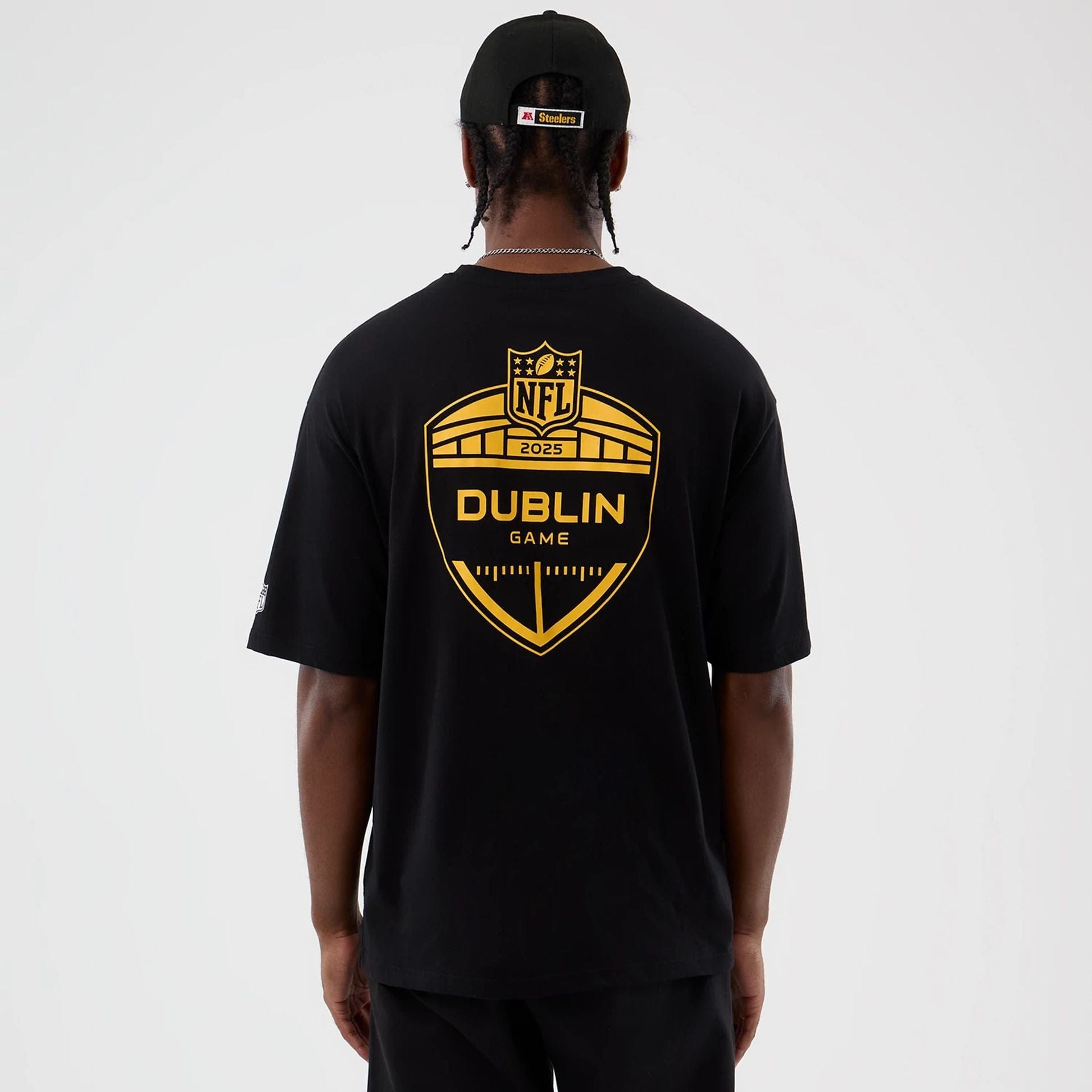 The Male model is wearing Pittsburgh Steelers NFL International Series Games Black Oversized T-Shirt 2