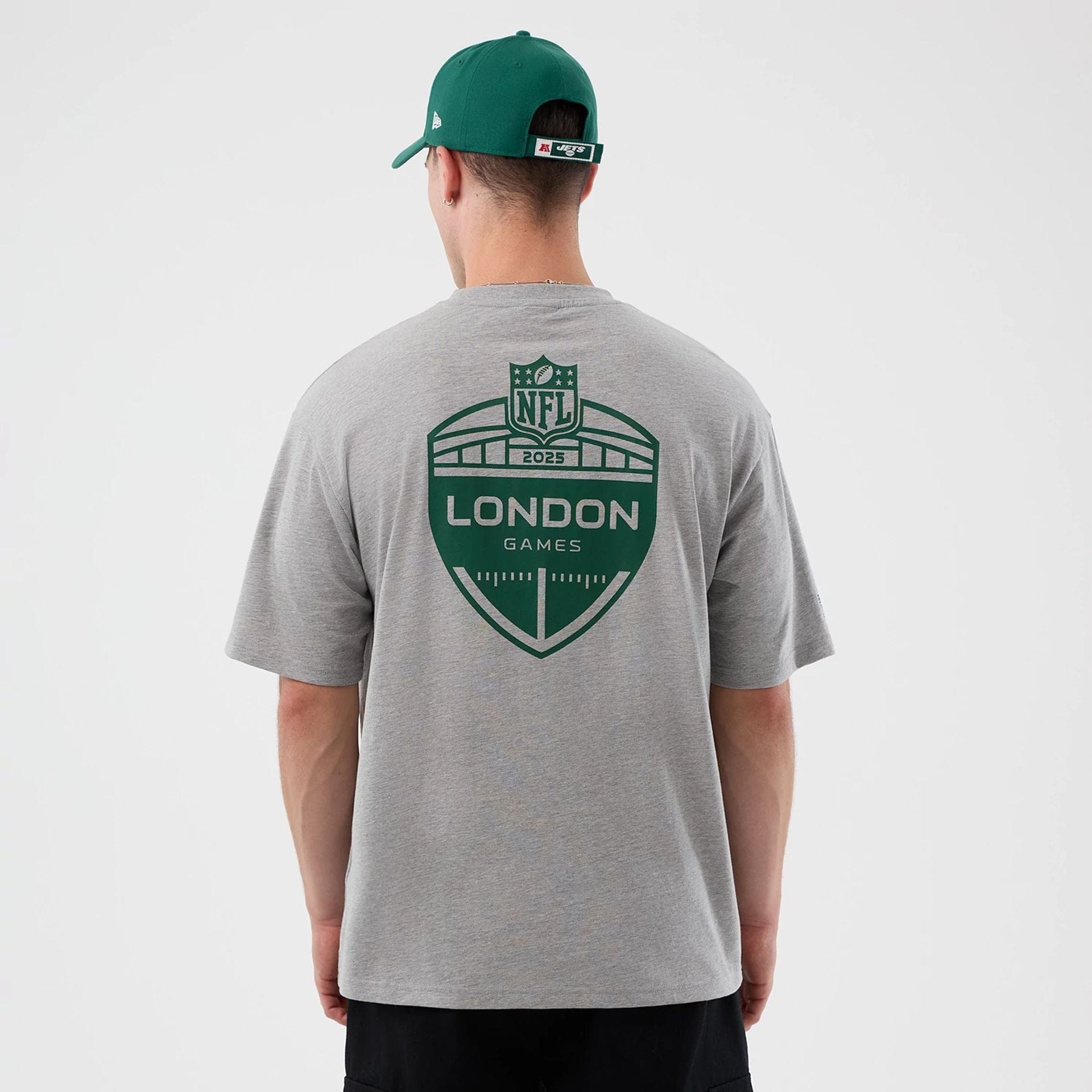 The Male model is wearing New York Jets NFL International Series Games Grey Oversized T-Shirt 2