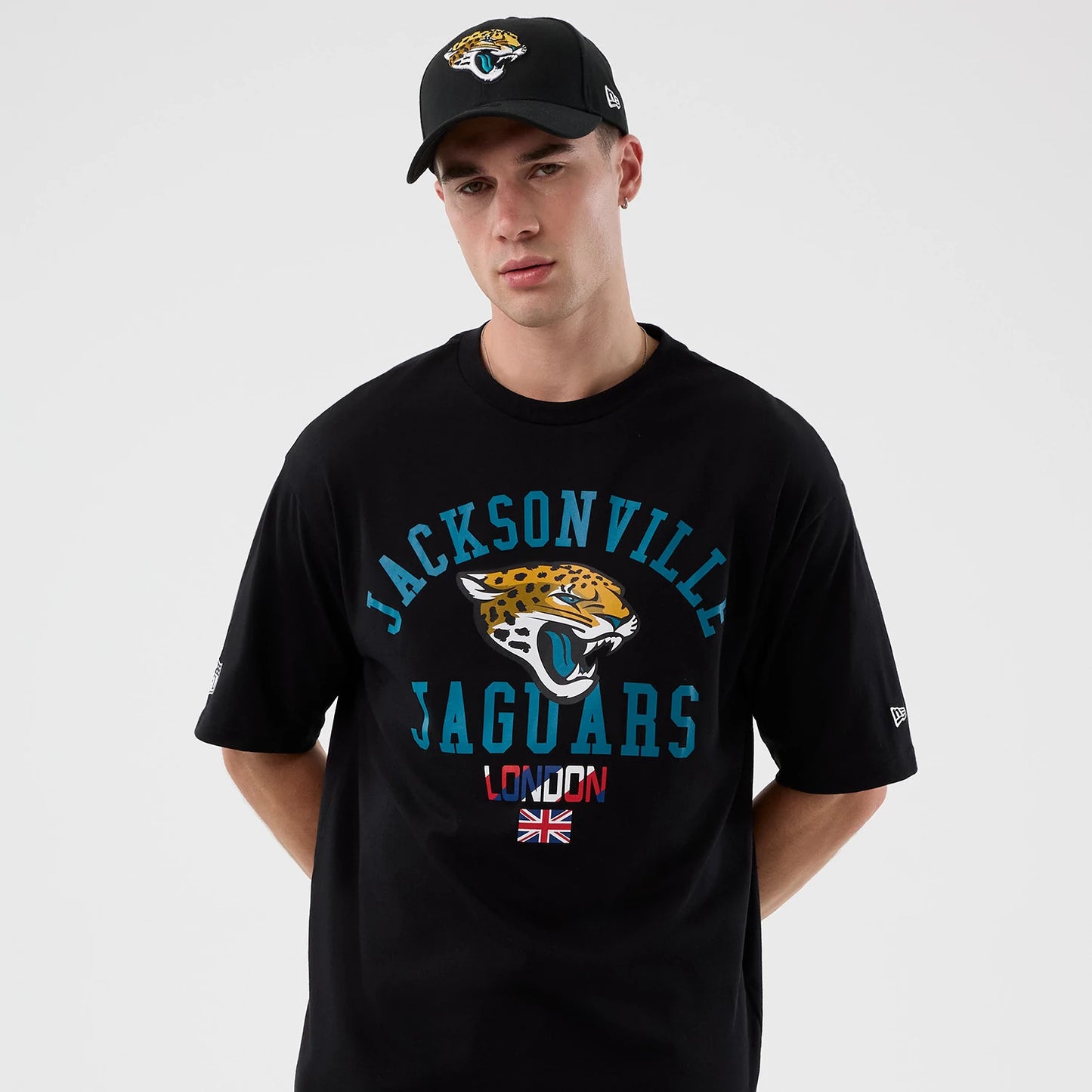 The Male model is wearing Jacksonville Jaguars NFL International Series Games London Black Oversized T-Shirt 7