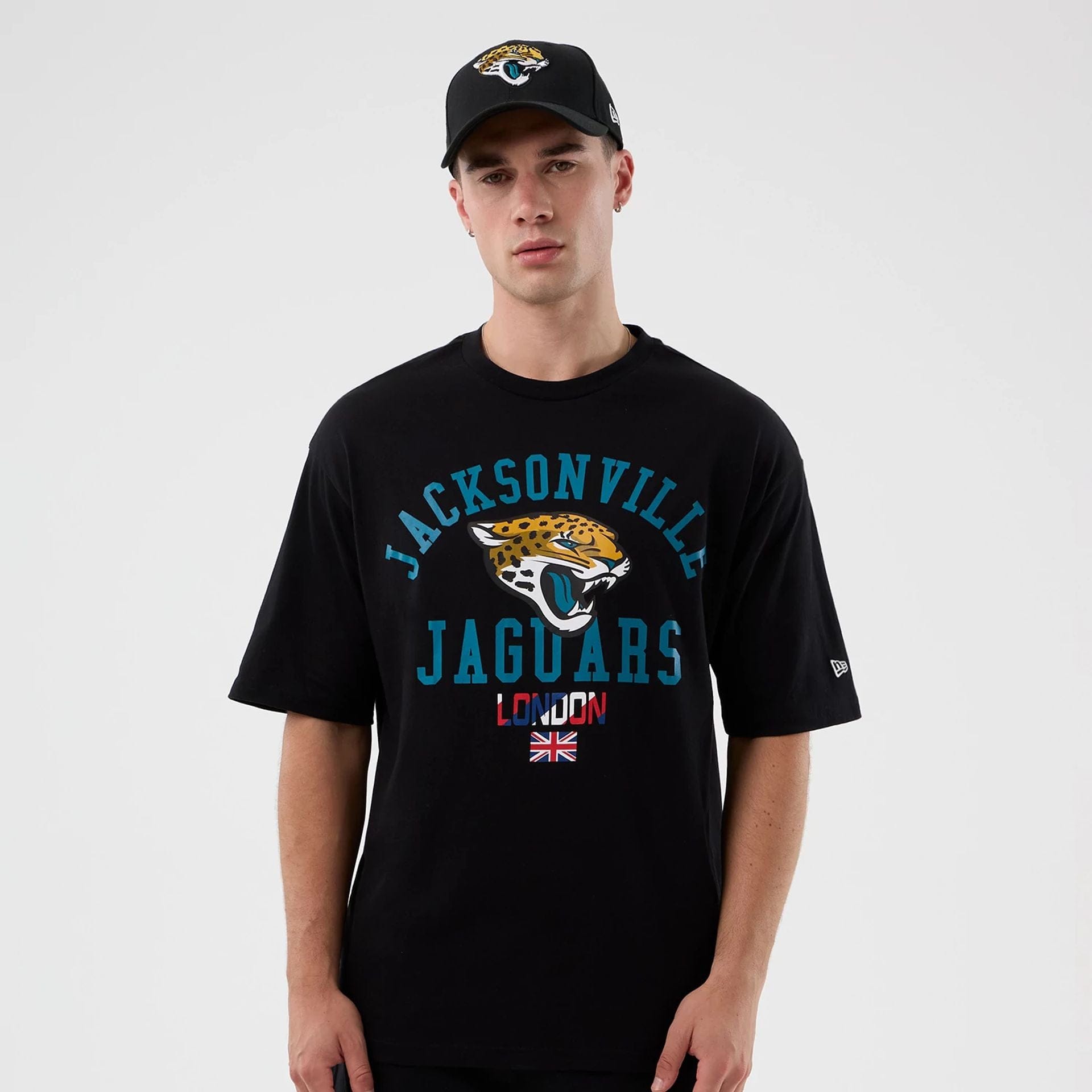 The Male model is wearing Jacksonville Jaguars NFL International Series Games Black Oversized T-Shirt 1
