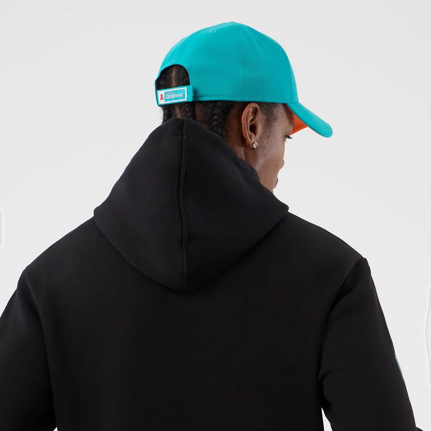 The Male model is wearing Miami Dolphins NFL International Series Games Patch Black Pullover Hoodie 7