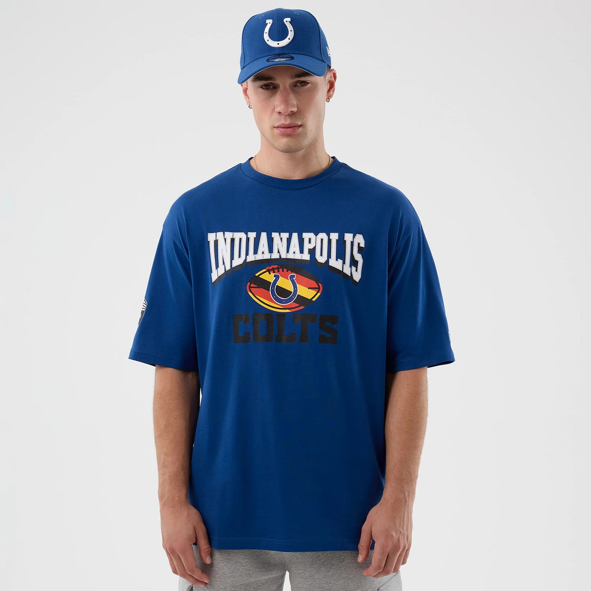 The Male model is wearing Indianapolis Colts NFL International Series Games Script Blue Oversized T-Shirt 1