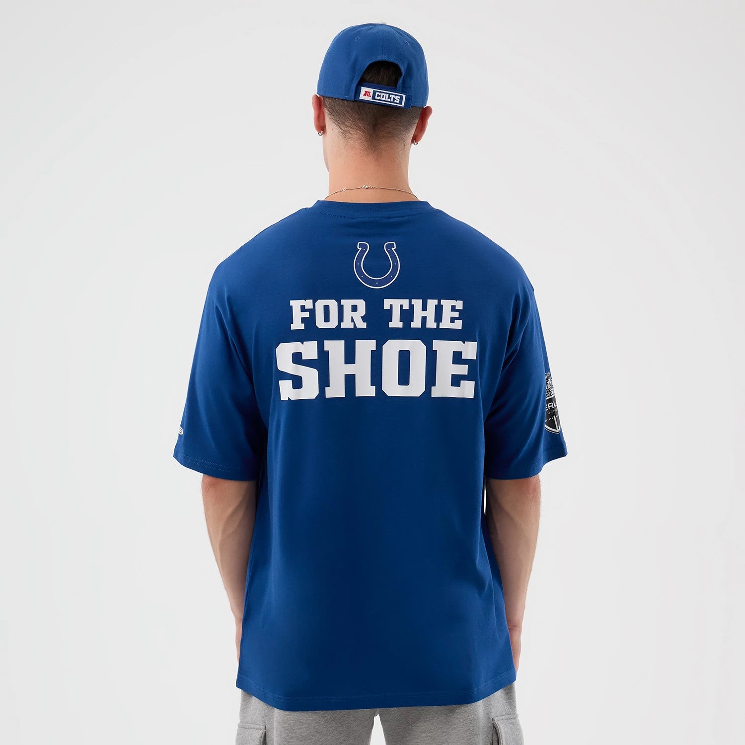 The Male model is wearing Indianapolis Colts NFL International Series Games Script Blue Oversized T-Shirt 2