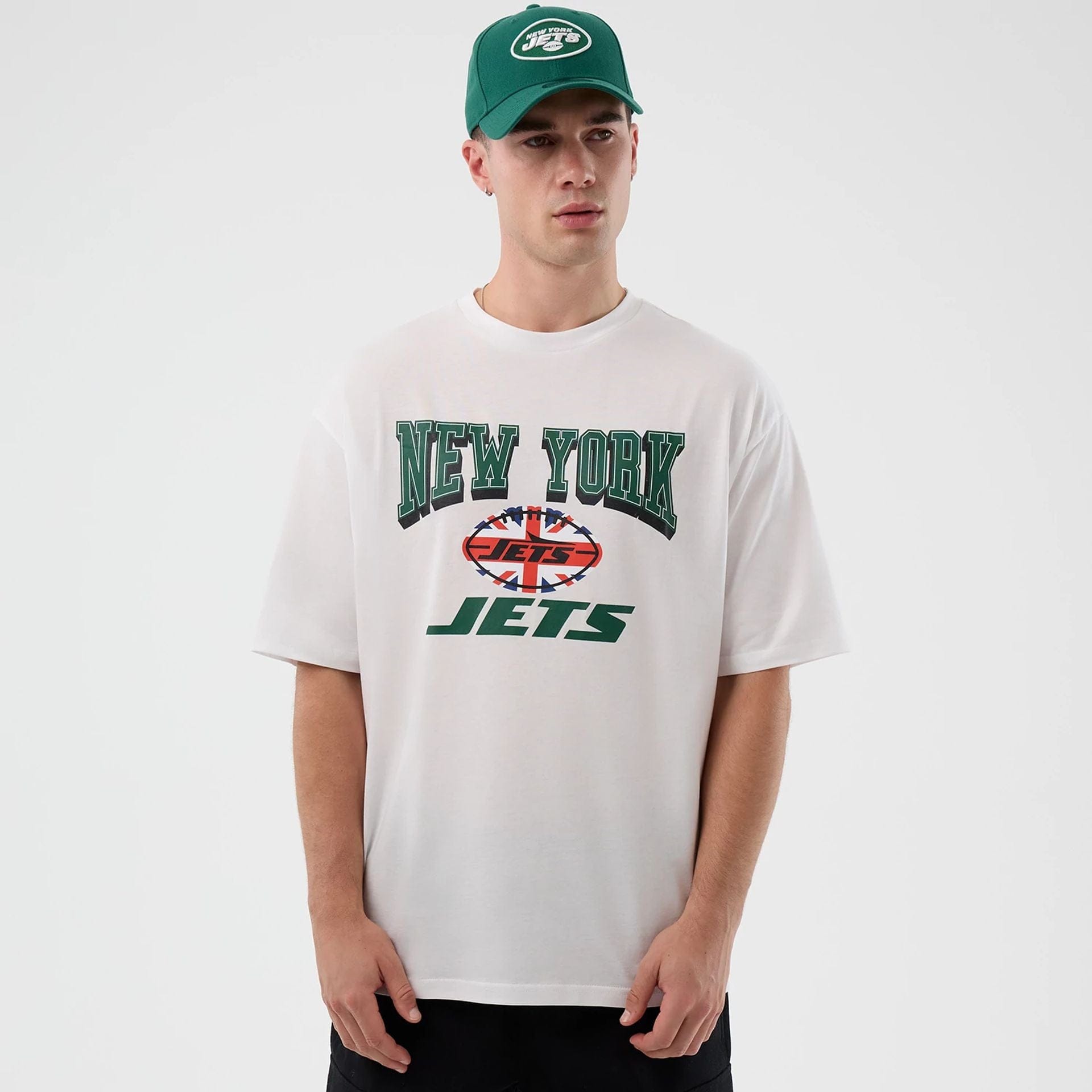 The Male model is wearing New York Jets NFL International Series Games White Oversized T-Shirt 1