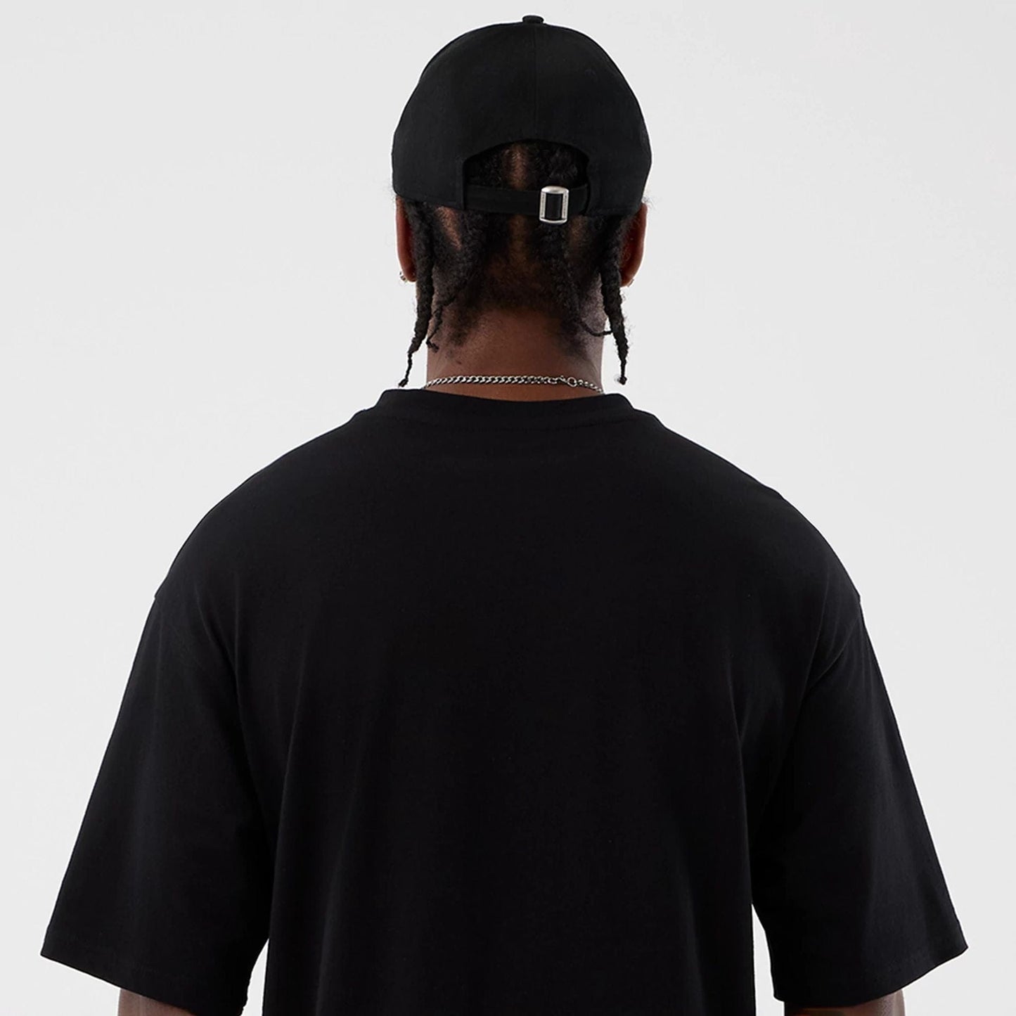 The Male model is wearing Berlin NFL International Series Games Black Oversized T-Shirt 7