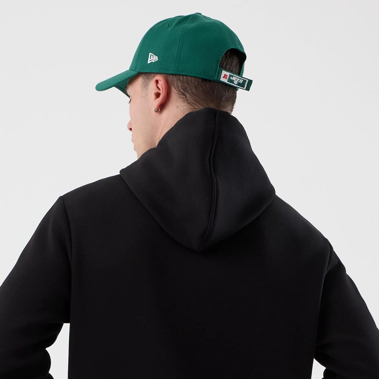 The Male model is wearing New York Jets NFL International Series Games Black Pullover Hoodie 7