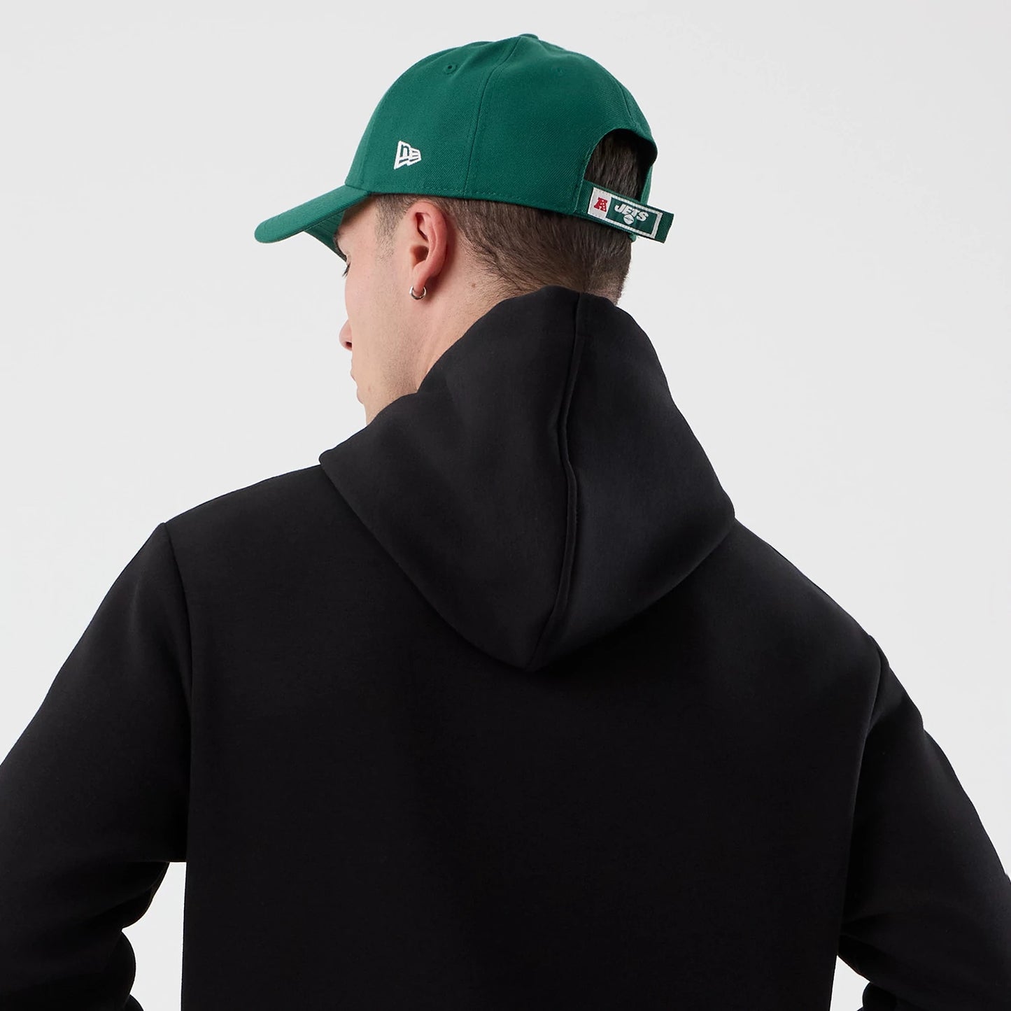 The Male model is wearing New York Jets NFL International Series Games Black Pullover Hoodie 7