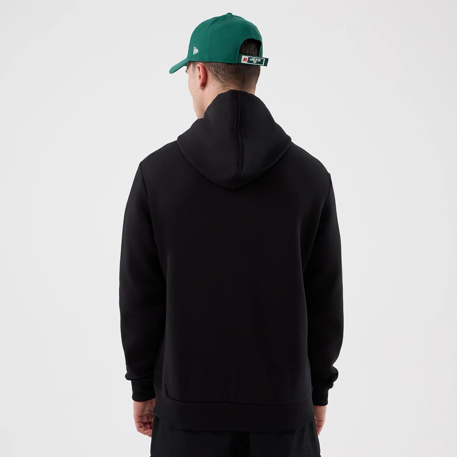 The Male model is wearing New York Jets NFL International Series Games Black Pullover Hoodie 2