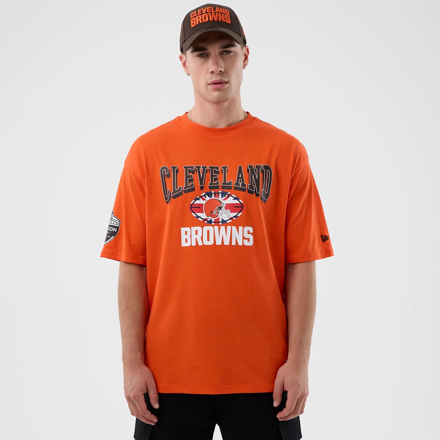 The Male model is wearing Cleveland Browns NFL International Series Games Orange Oversized T-Shirt 1