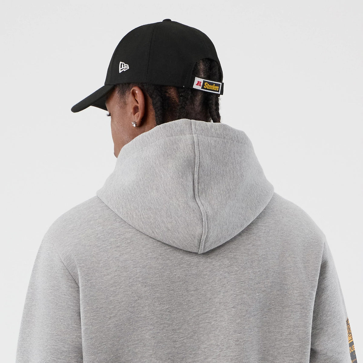 The Male model is wearing Pittsburgh Steelers NFL International Series Games Grey Pullover Hoodie 7
