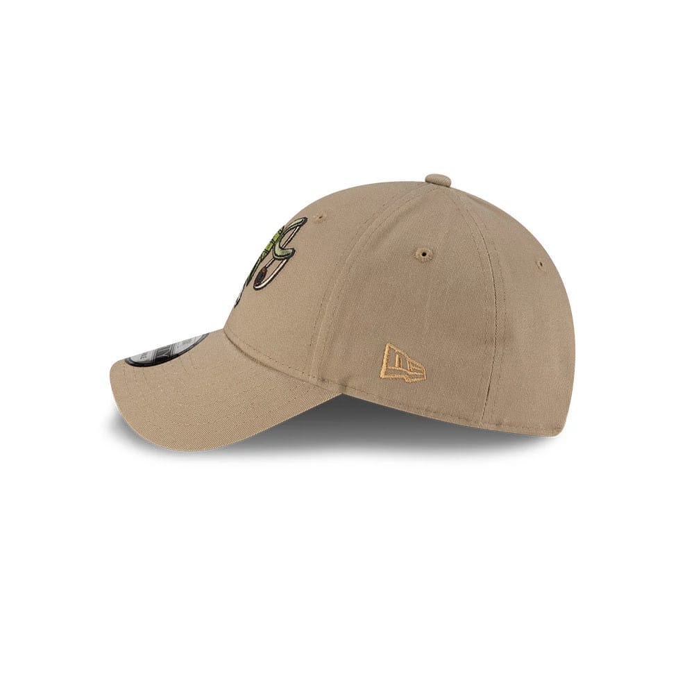 One Piece Usopp Beige New Era 9FORTY Adjustable Cap, side view showing the gold New Era flag logo embroidered on the left side of the structured beige crown with slightly curved visor and a size sticker on top.