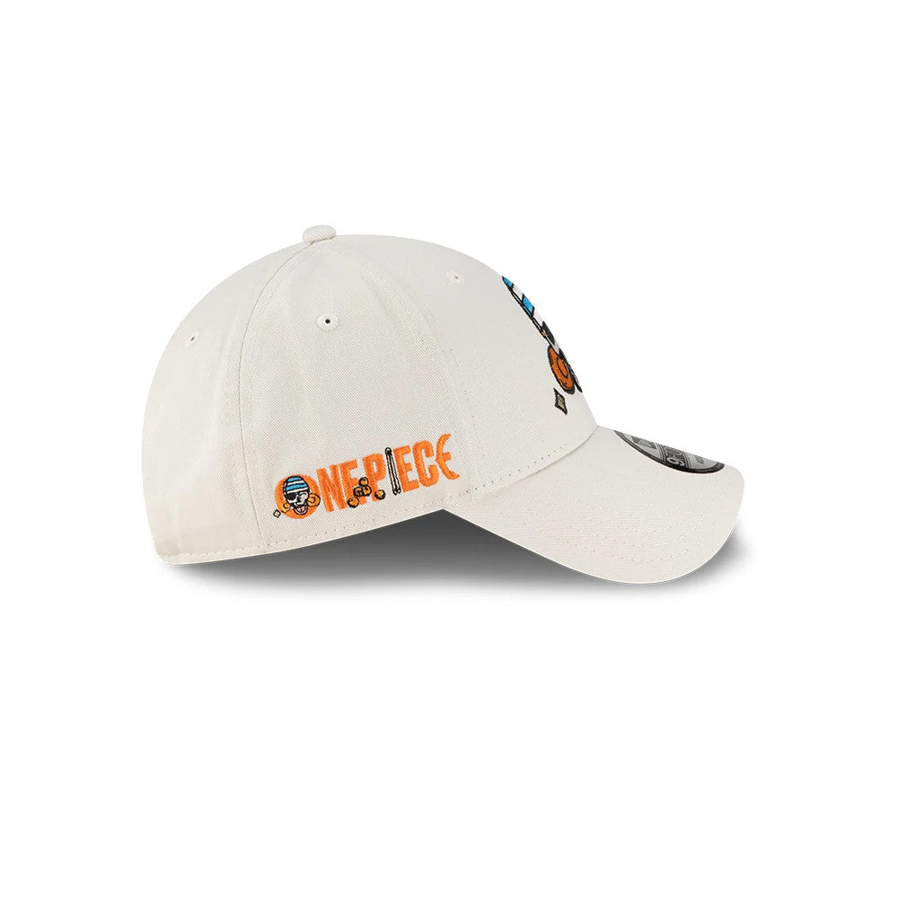 One Piece Nami Light Beige New Era 9FORTY Adjustable Cap, side view showing the orange embroidered One Piece logo on the left side, with a curved light beige visor and a 9FORTY size sticker on top.