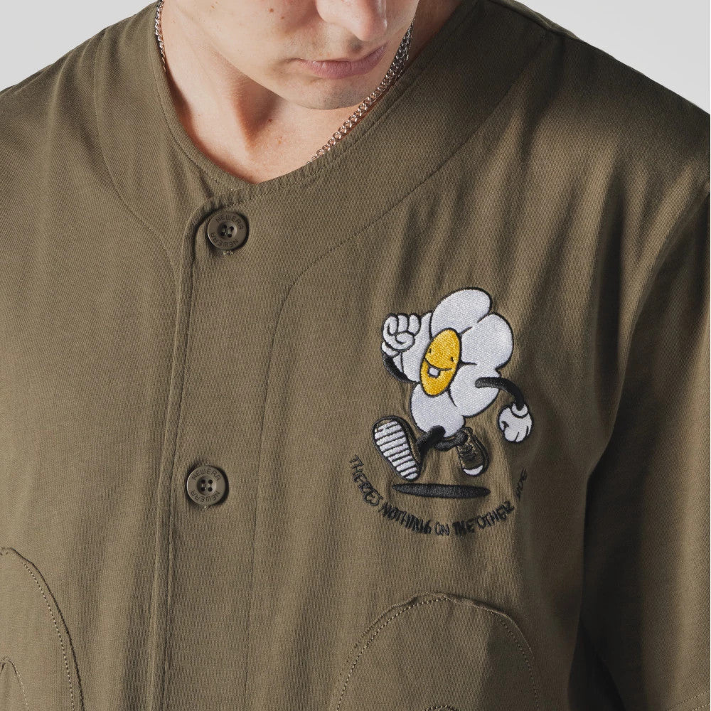 The Male model is wearing New Era x Rodrigo Roji Flower Green Jersey 4