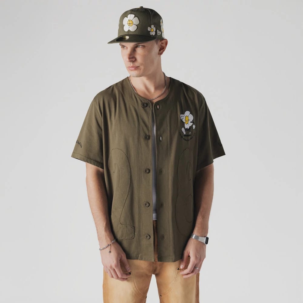 The Male model is wearing New Era x Rodrigo Roji Flower Green Jersey 1