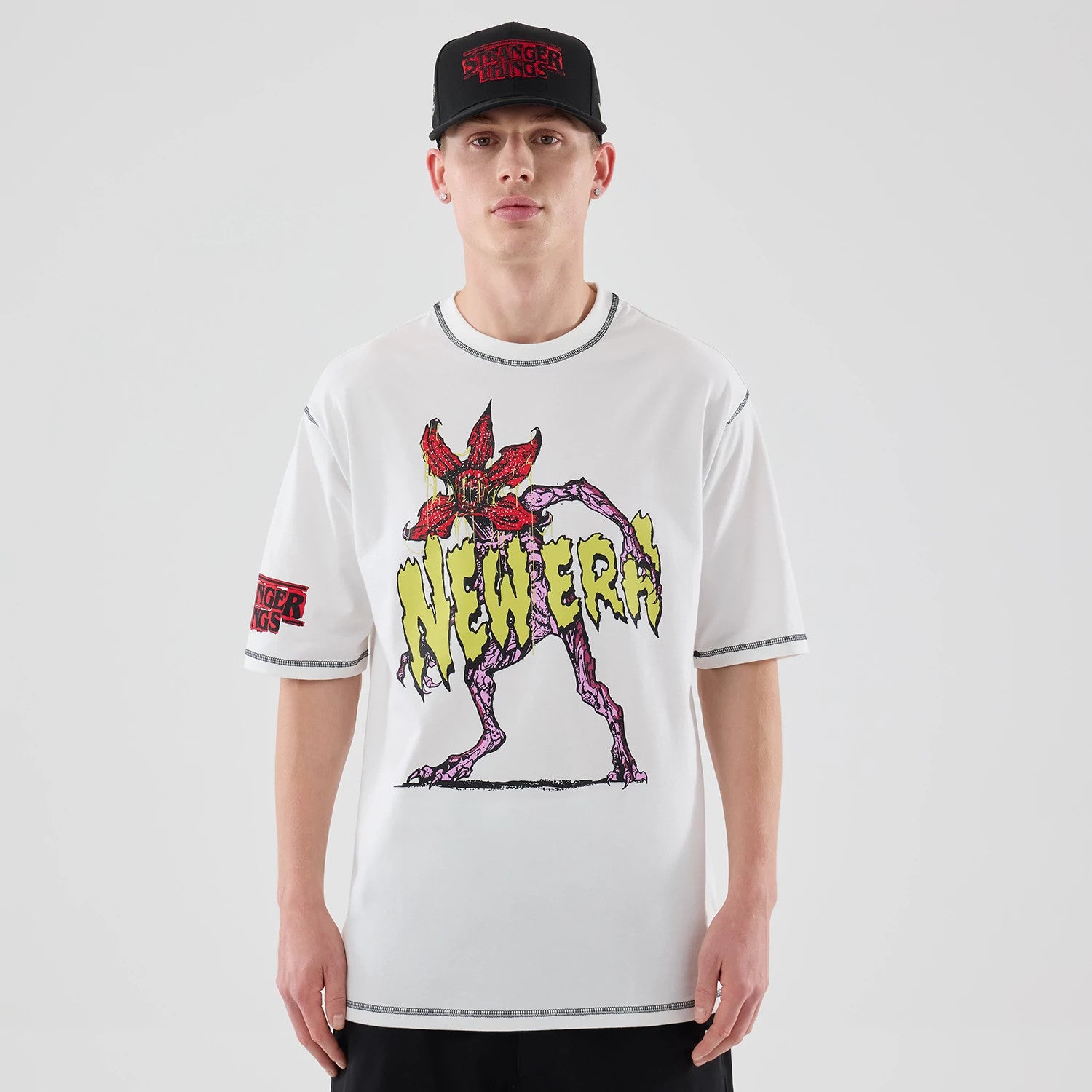 The Male model is wearing Stranger Things White Oversized T-Shirt 1