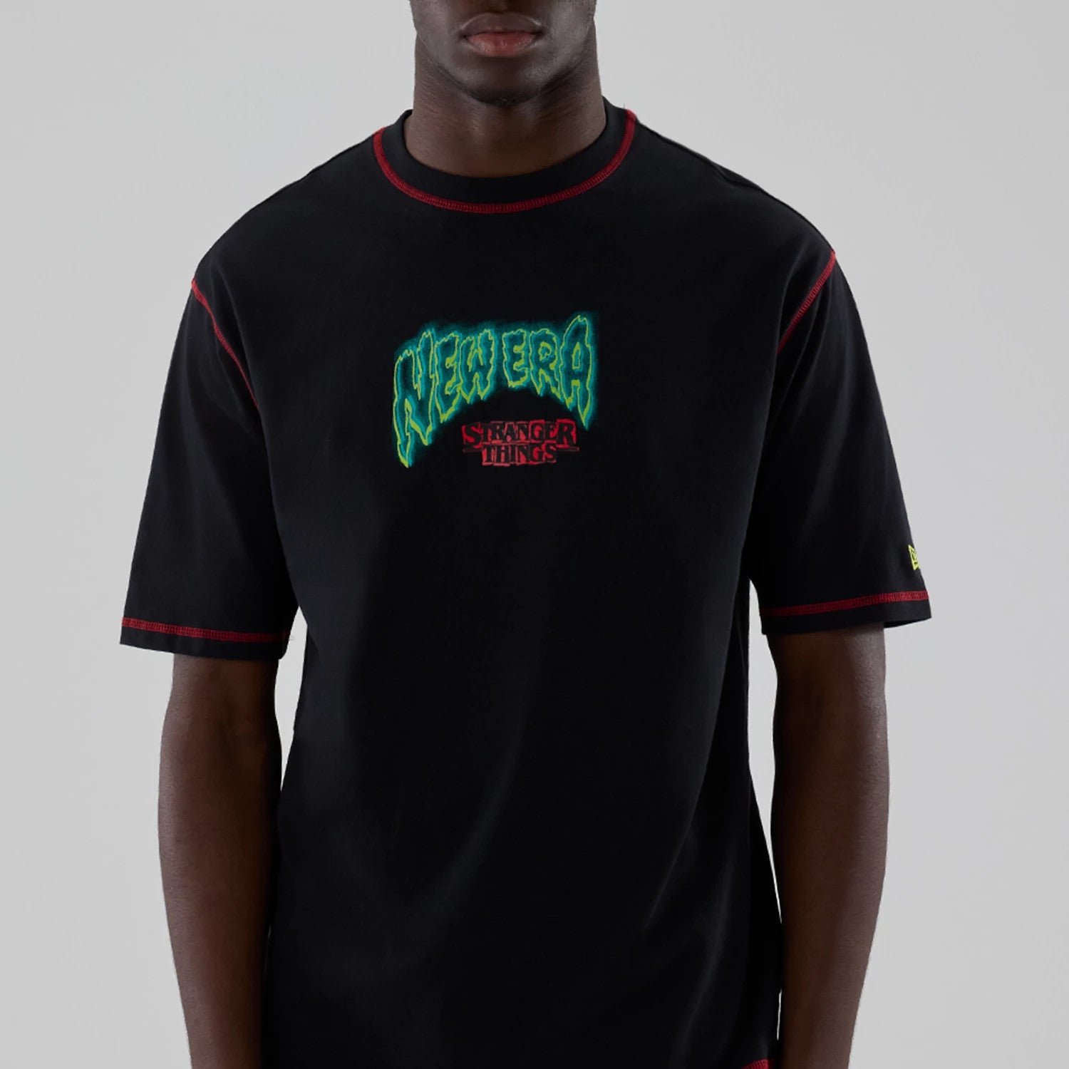 The Male model is wearing Stranger Things Black Oversized T-Shirt 3