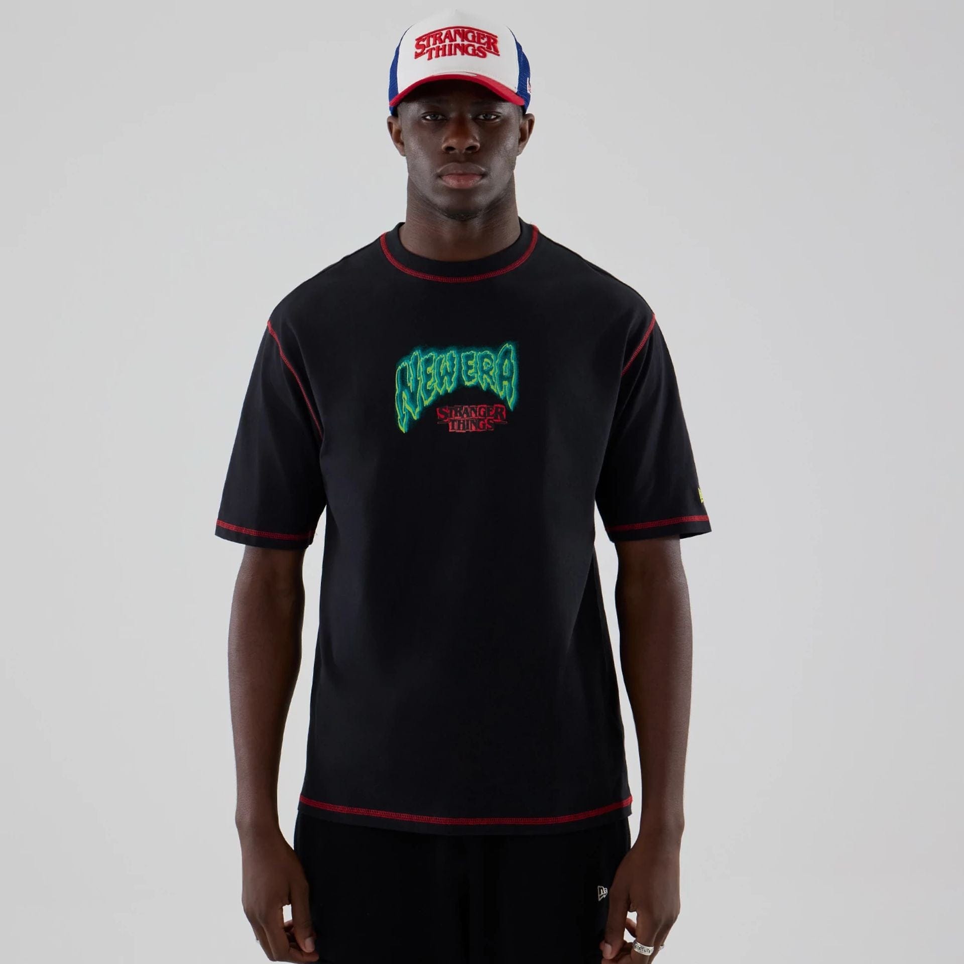 The Male model is wearing Stranger Things Black Oversized T-Shirt 1