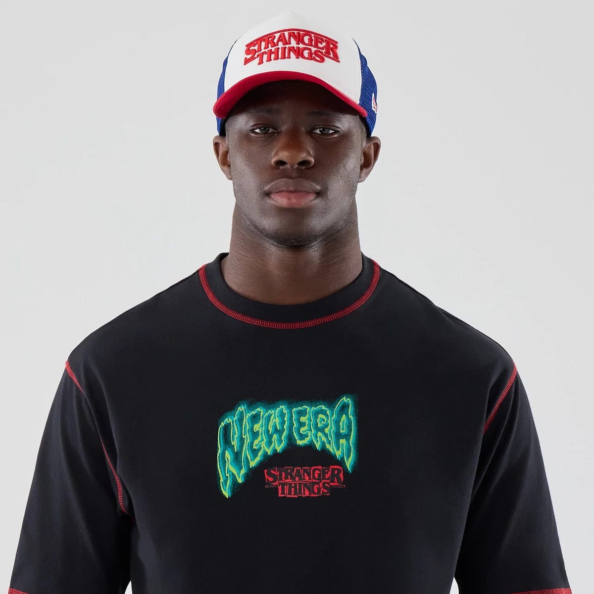 The Male model is wearing Stranger Things Black Oversized T-Shirt 7