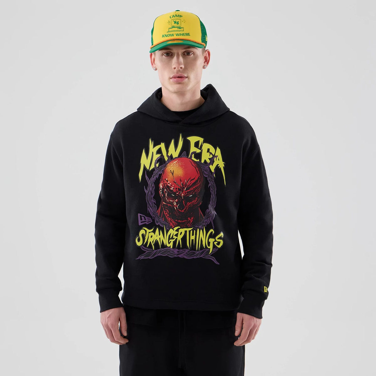 The Male model is wearing Stranger Things Black Oversized Pullover Hoodie 1