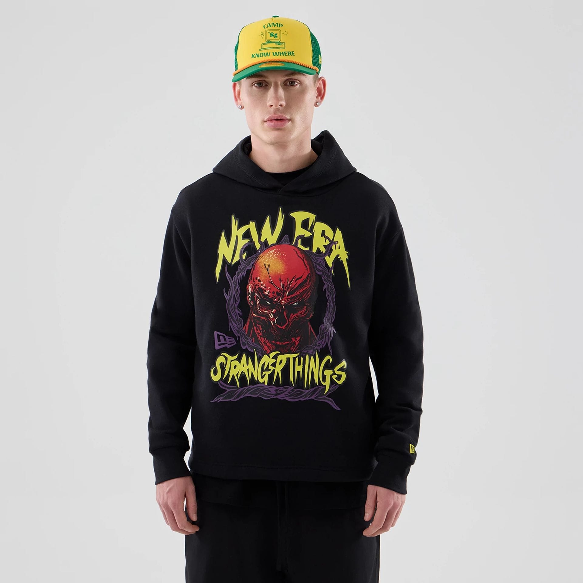 The Male model is wearing Stranger Things Black Oversized Pullover Hoodie 1