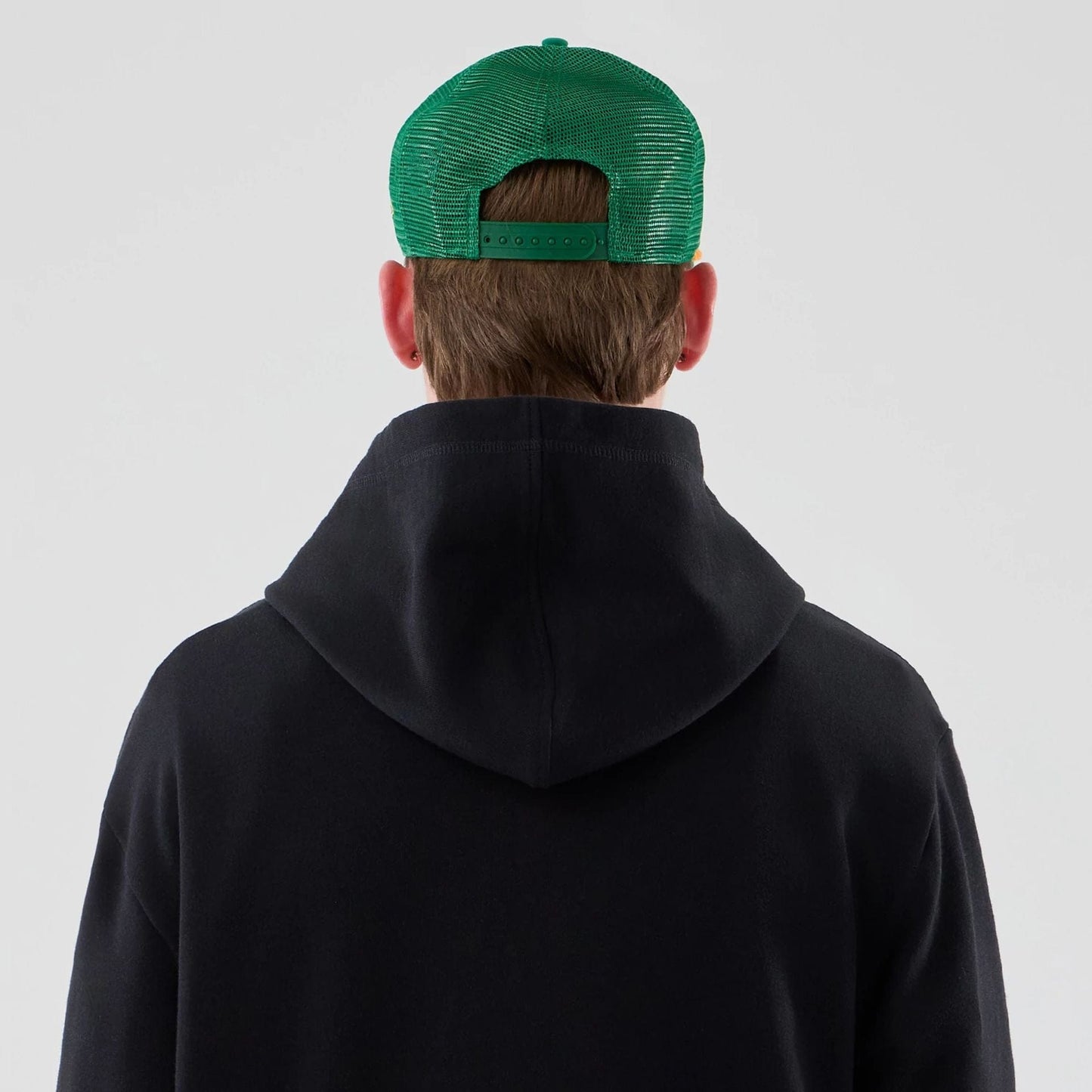 The Male model is wearing Stranger Things Black Oversized Pullover Hoodie 7