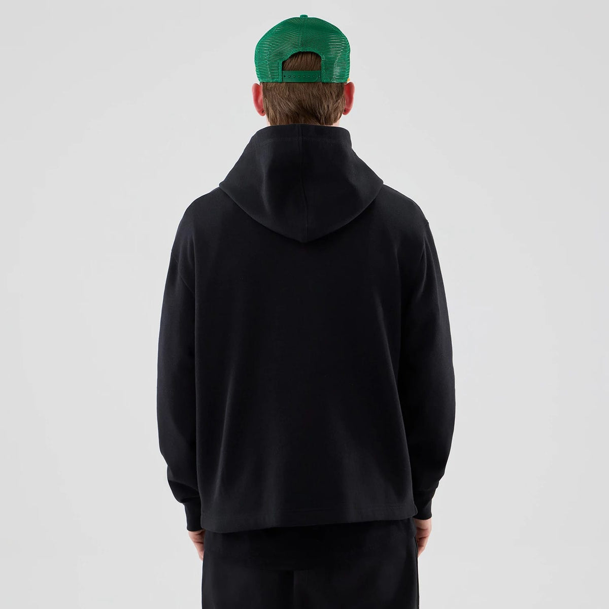 The Male model is wearing Stranger Things Black Oversized Pullover Hoodie 2