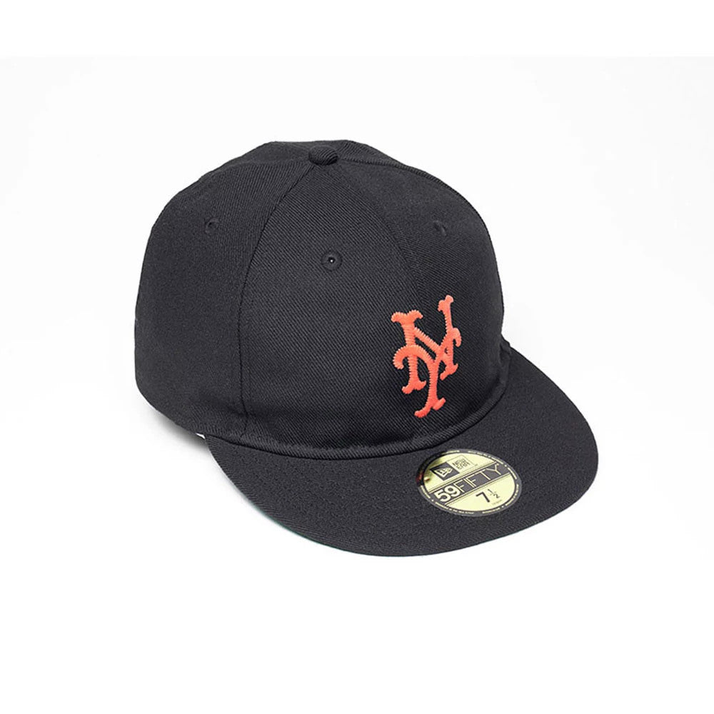 New York Mets MLB Soft Black New Era 59FIFTY Fitted Cap, three-quarter view showing the orange embroidered NY logo on the front panel, black flat visor with a gold 59FIFTY size sticker, and top button.