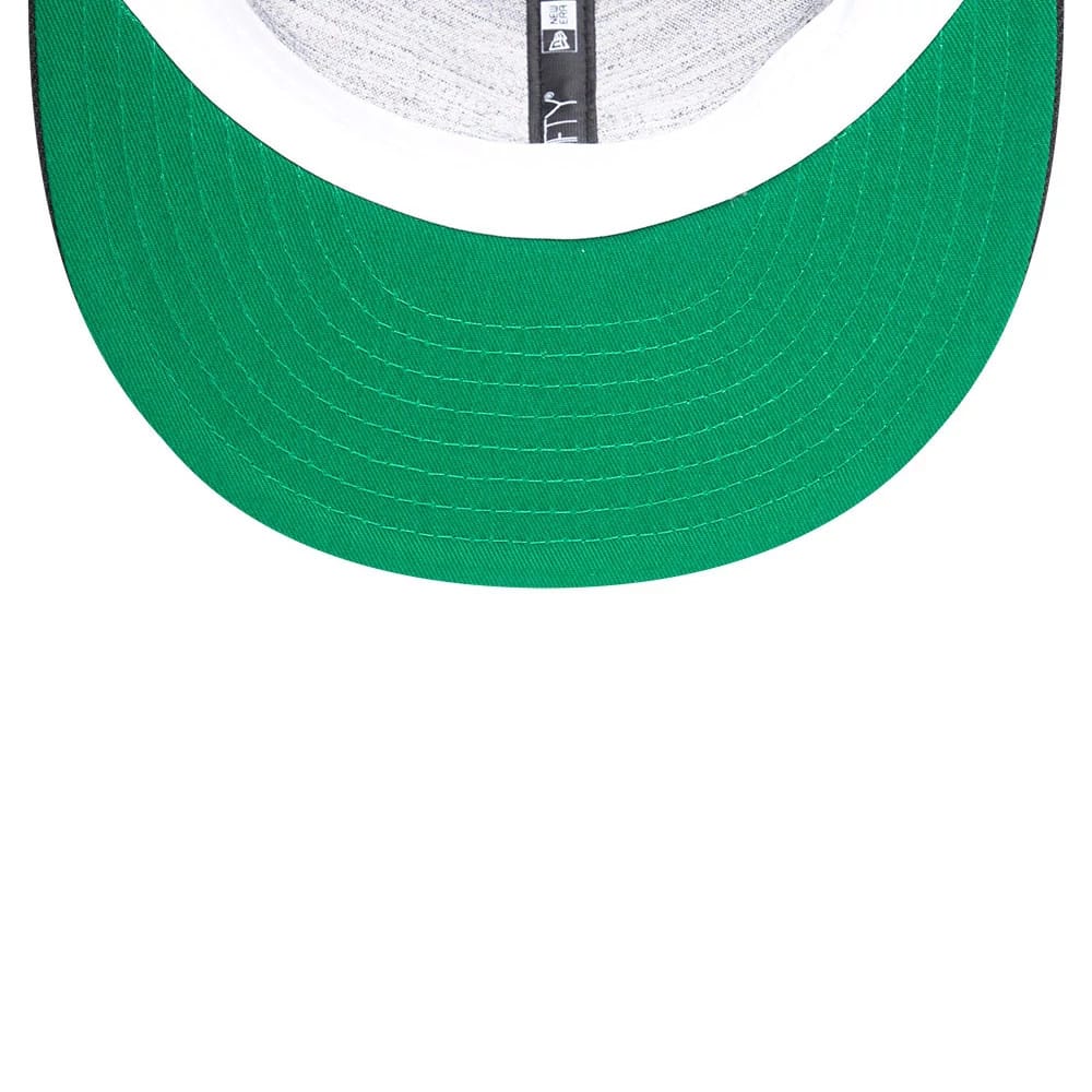 New York Yankees MLB Soft Black New Era 59FIFTY Fitted Cap, inside view showing the green undervisor and grey taping along the interior seams, with part of the New Era logo on the taping.