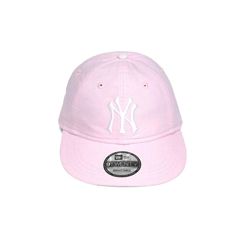 New York Yankees MLB Oxford Pastel Pink New Era 9TWENTY Long Visor Adjustable Cap, front view showing a white raised embroidered NY logo on the pink front panel, with a 9TWENTY size sticker on the visor and matching pastel pink eyelets.
