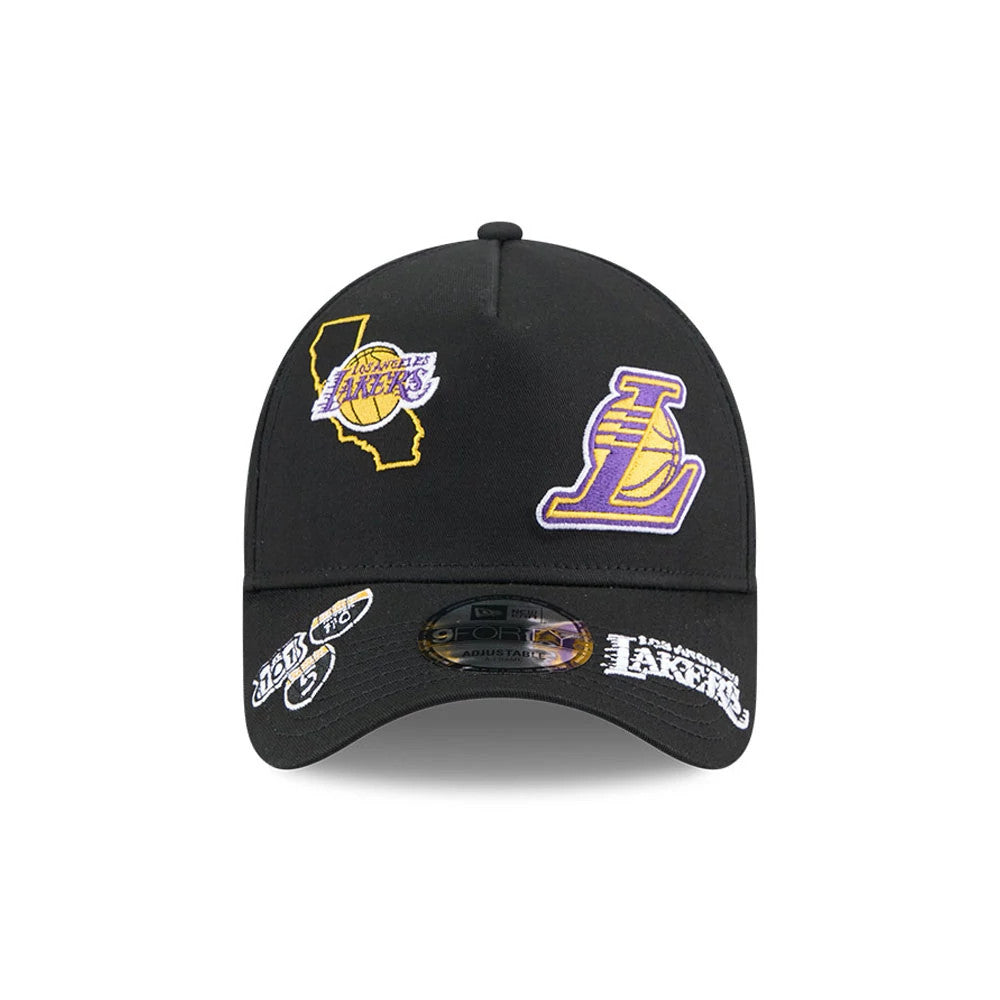 LA Lakers NBA All Over Black New Era 9FORTY A-Frame Adjustable Cap, front view showing a raised purple and yellow Lakers logo on the front panel, black curved visor with embroidered team patches, and a 9FORTY size sticker.