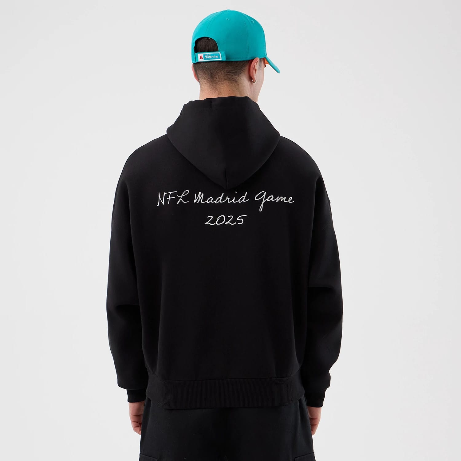 The Male model is wearing Miami Dolphins NFL International Series Games Black Pullover Hoodie 2