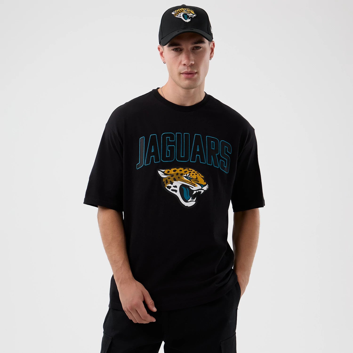 The Male model is wearing Jacksonville Jaguars NFL International Series Games Script Black Oversized T-Shirt 1