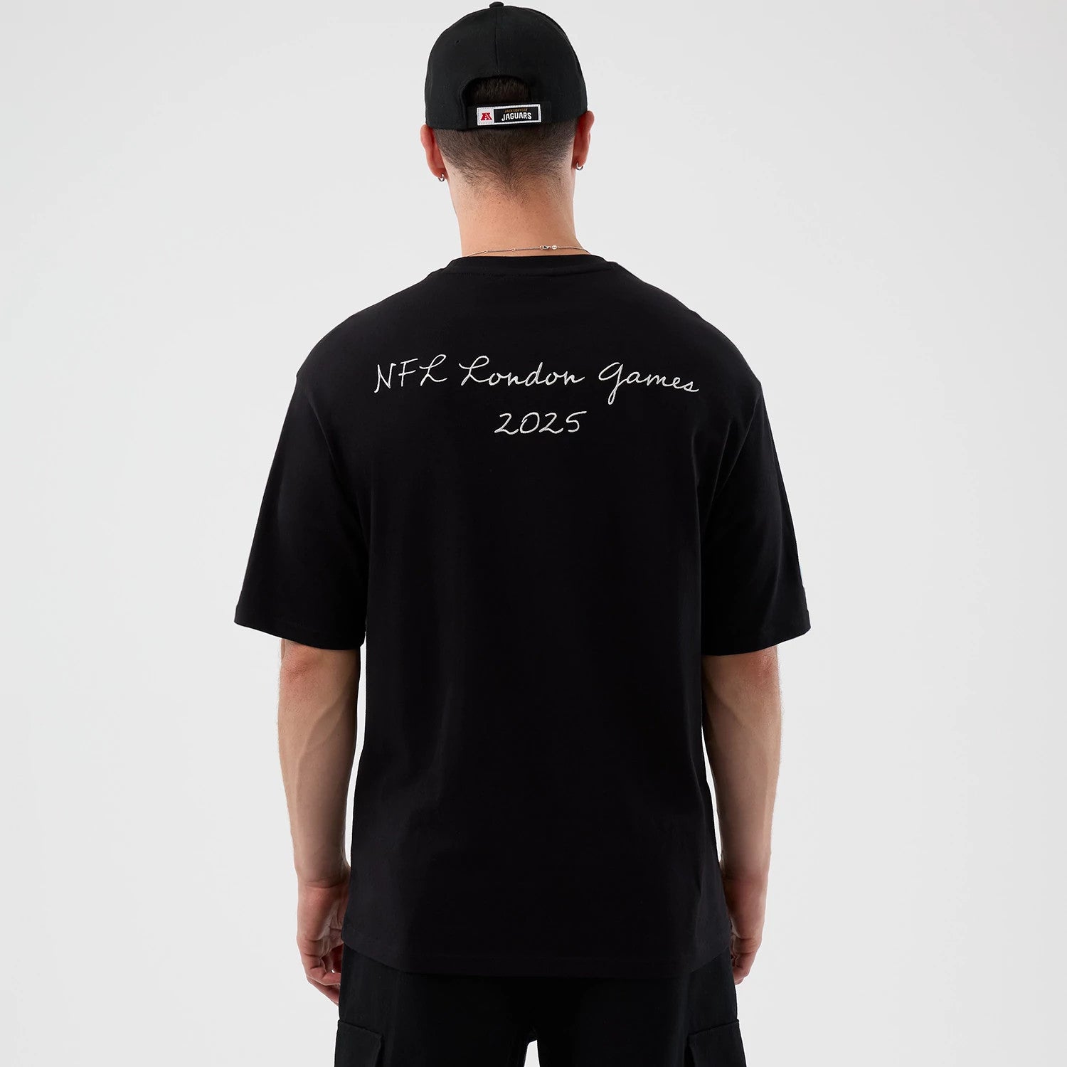 The Male model is wearing Jacksonville Jaguars NFL International Series Games Script Black Oversized T-Shirt 2