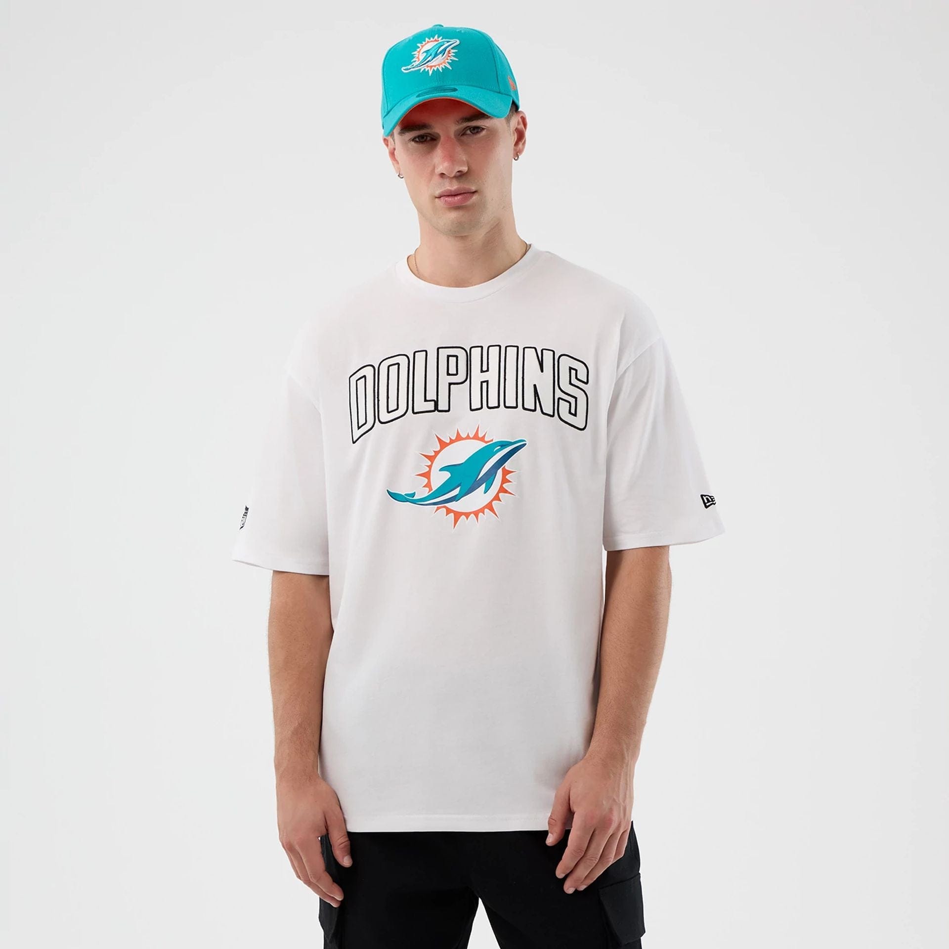 The Male model is wearing Miami Dolphins NFL International Series Games White Oversized T-Shirt 1