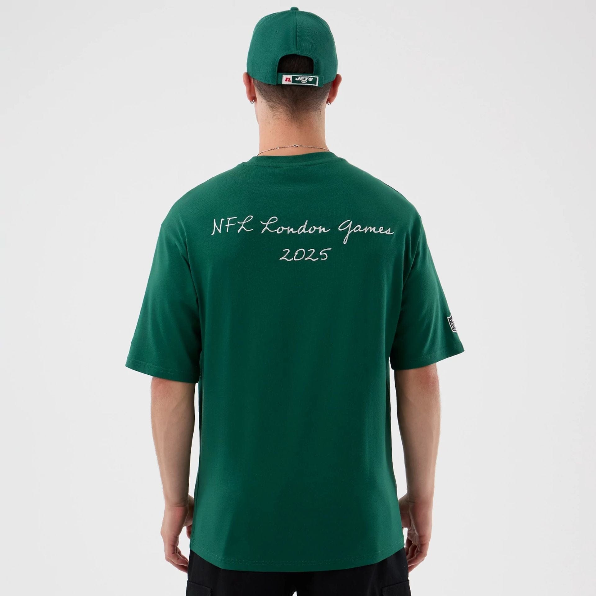 The Male model is wearing New York Jets NFL International Series Games Green Oversized T-Shirt 2