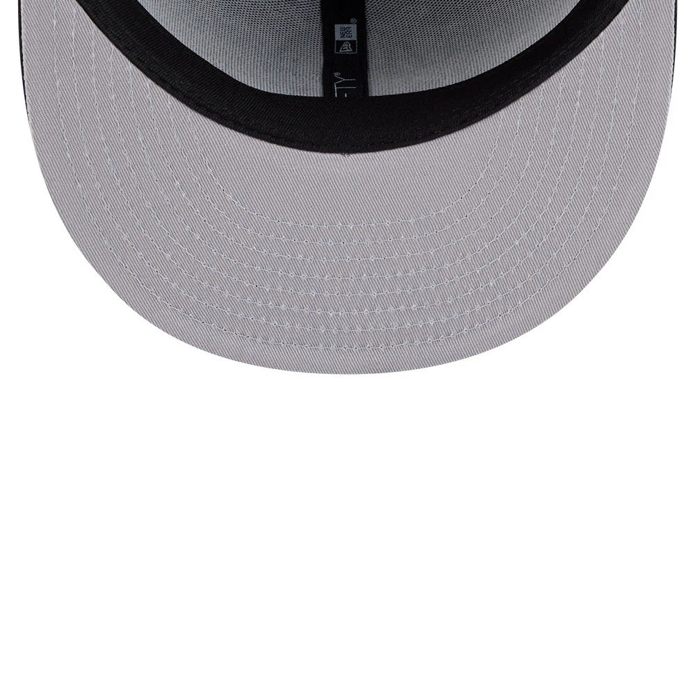 Anaheim Ducks NHL Evergreen Black New Era 59FIFTY Fitted Cap, inside view showing a grey undervisor with black sweatband and taping, featuring the New Era logo and team branding on the taping.