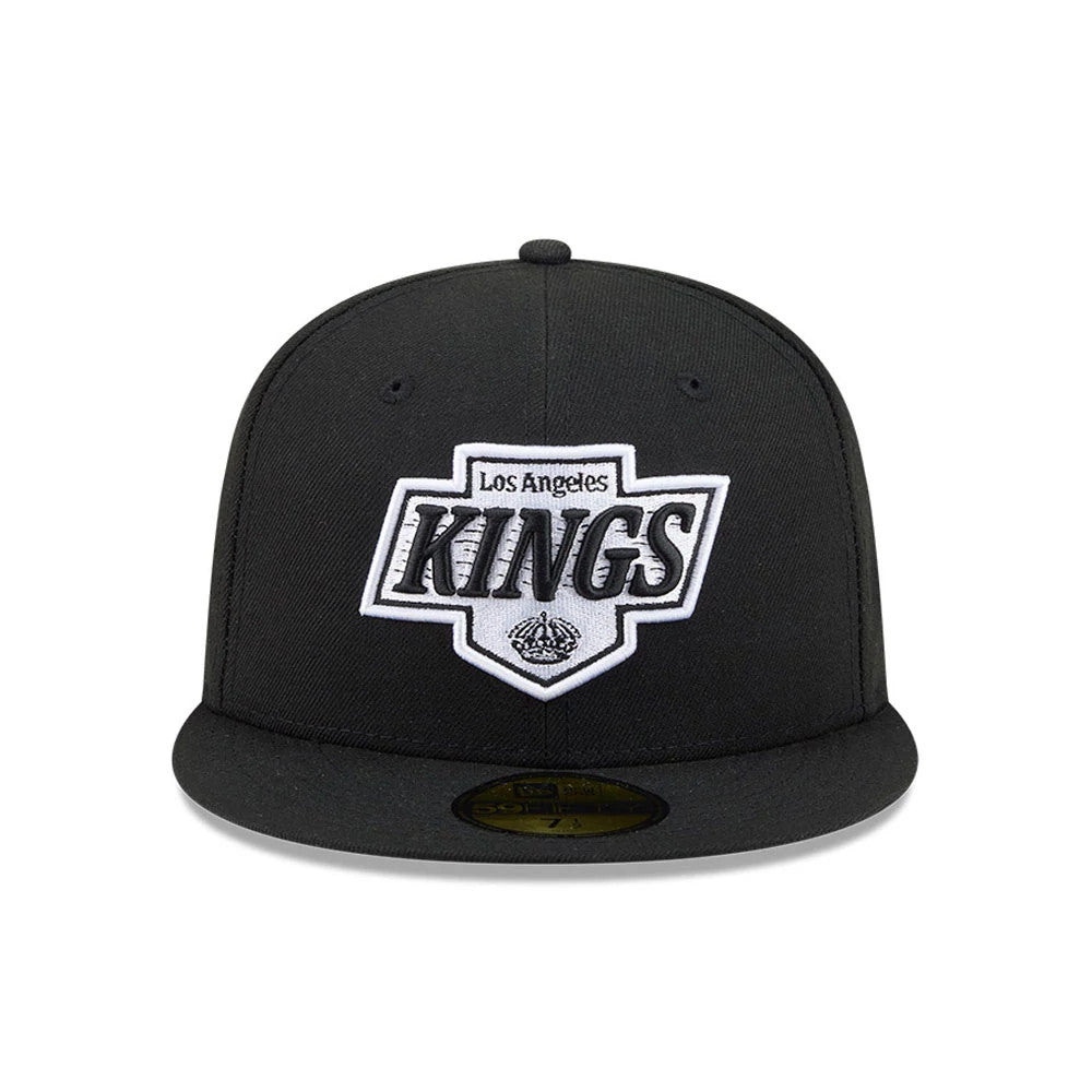 LA Kings NHL Evergreen Black New Era 59FIFTY Fitted Cap, front view showing the white and black embroidered LA Kings logo on the structured black crown, with a flat visor and gold 59FIFTY size sticker on top.