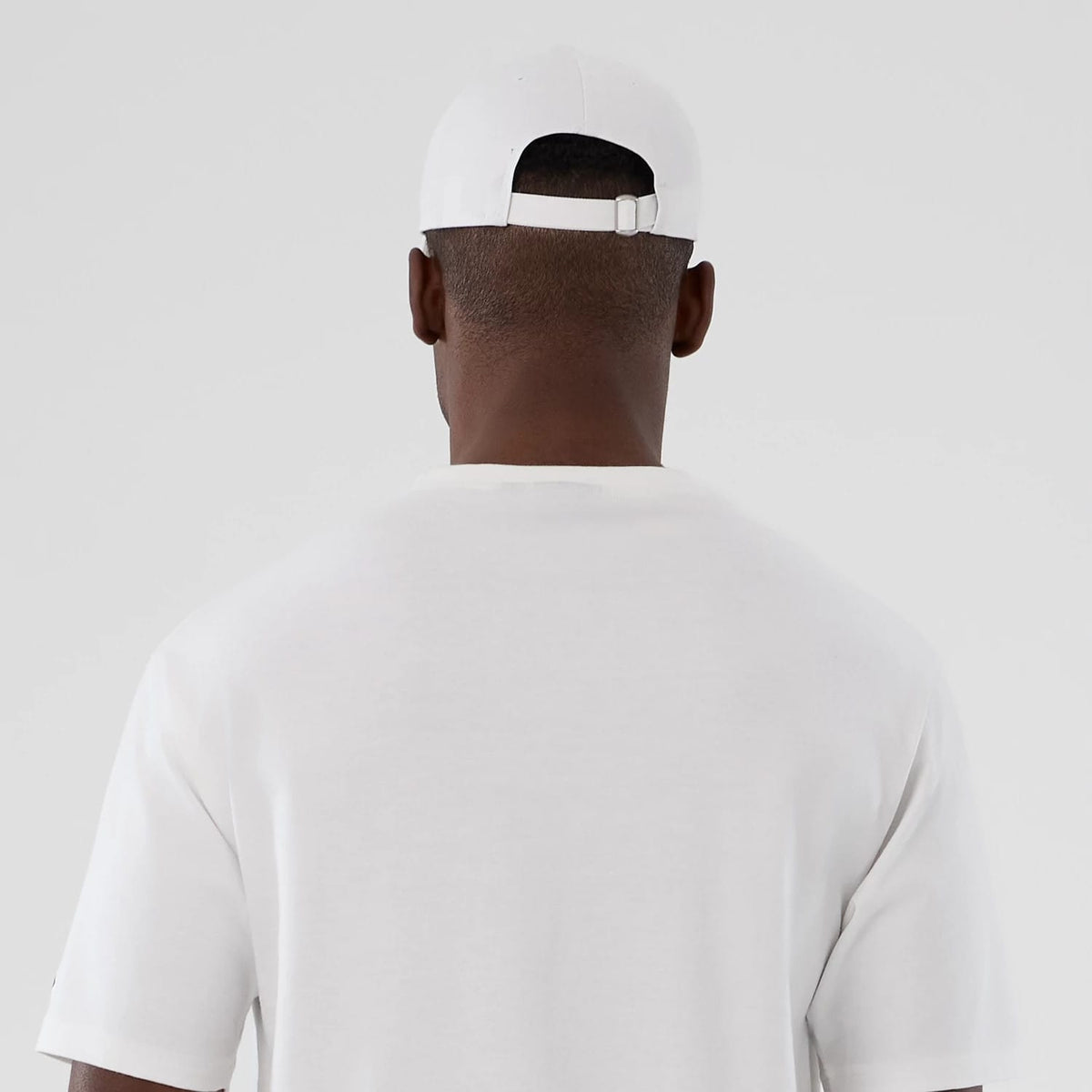 The Male model is wearing New Era Halloween Skull Graphic White Oversized T-Shirt 7